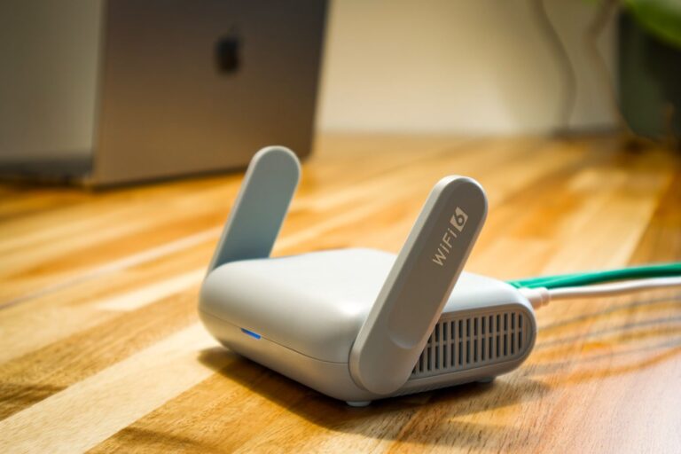 A Wi-Fi router and network cable on a desk